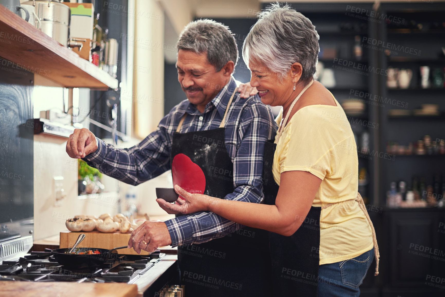 Buy stock photo Food, happy senior couple cooking in kitchen and at their home. Collaboration or teamwork of partners, family or marriage and smiling people baking or preparing a meal together in their house