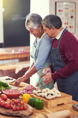 Buy stock photo Cooking, vegetables and senior couple in kitchen at home with cutting ingredients for meal. Love, food and elderly man and woman preparing dinner, lunch or supper together at house in Mexico.