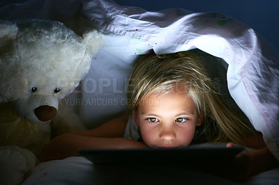 Buy stock photo Tablet, bedroom and kid in home at night for streaming movie, video or cartoon to relax. Digital technology, girl and child in bed for game, internet addiction or reading story online with teddy bear