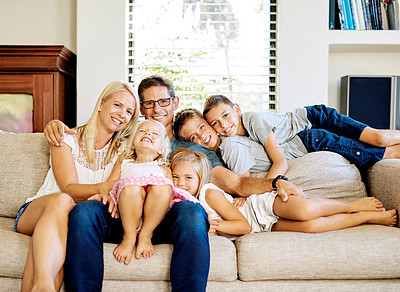 Buy stock photo Portrait, mother and father with children in home, relaxing and bonding together on weekend with happiness. Sofa, dad and mom with kids for security, connection and cheerful relationship as family