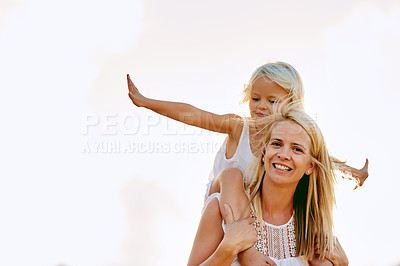 Buy stock photo Shot of a mother and her daughter playing outside
