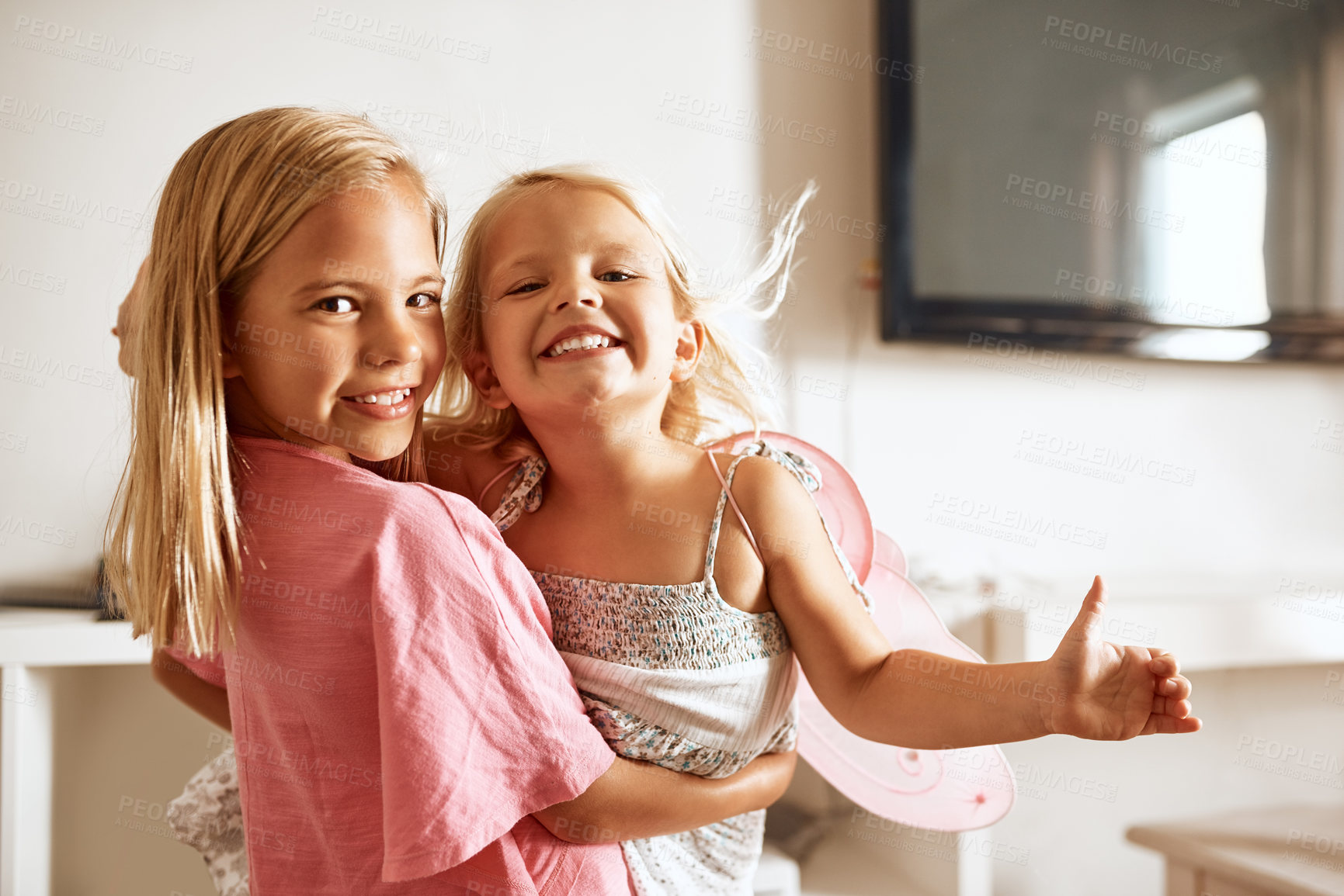 Buy stock photo Carry, happy and portrait of girls in home or fairy costume for dress up, fantasy fun or tiara with smile. Family siblings, excited kids or sisters playing with wings or princess outfit for bonding