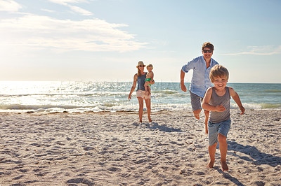 Buy stock photo Happy, family and children playing on the beach on holiday, travel or adventure in summer. Boy, father and kids with parents and outdoor ocean for fun energy and happiness with a game while running