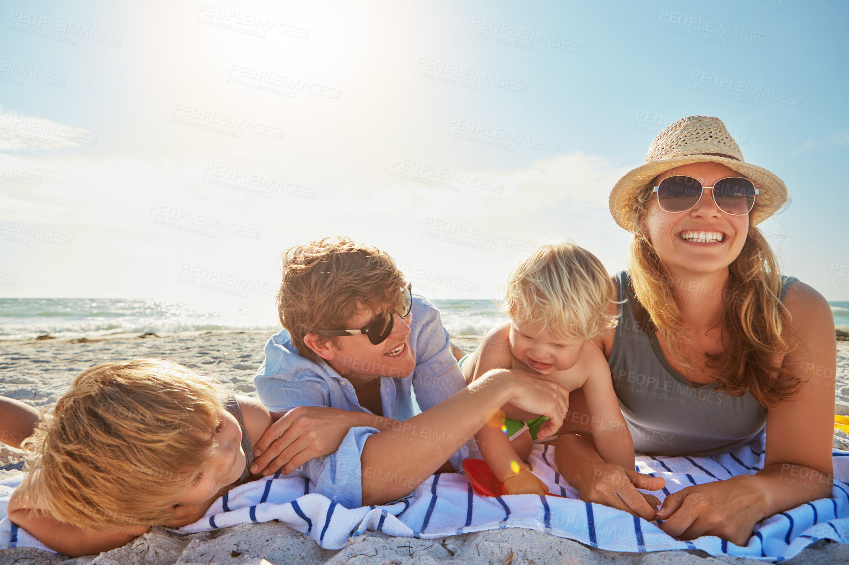 Buy stock photo Portrait, relax or children with parents at beach on holiday vacation or happy family weekend together. Father, fun mother or kids siblings at sea for bonding or playing in nature in Spain with love