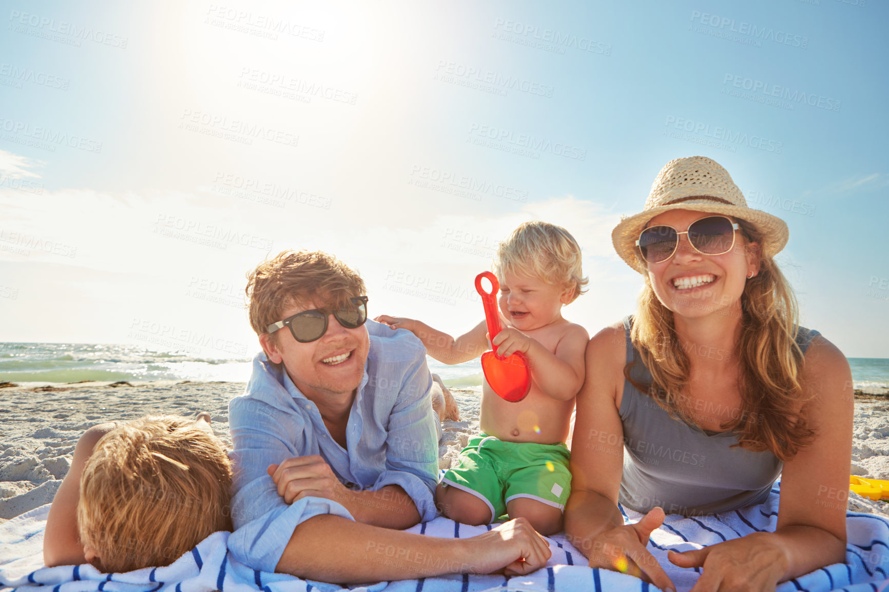 Buy stock photo Portrait, love or kids with parents at beach on holiday vacation or happy family weekend together. Father, fun mother or children siblings at sea for bonding or playing in nature in Spain to relax