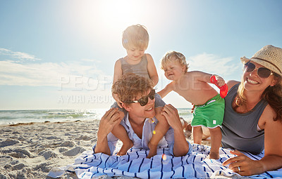 Buy stock photo Portrait, piggyback or kids with family at beach on holiday vacation or weekend together with parents. Father, mother or happy children siblings at sea for bonding, love or playing by ocean to relax