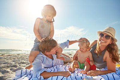 Buy stock photo Portrait, piggyback or kids with family at sea for vacation, holiday or summer together with parents. Father, mother or happy children siblings at beach for bonding, love or playing by ocean to relax