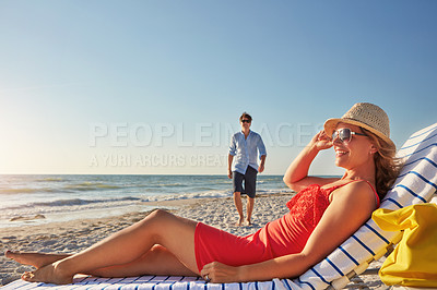 Buy stock photo Travel, couple and woman on chair at beach for sunshine, holiday and outdoor adventure together. Man, walking and smile with thinking by ocean for summer vacation, love and romantic honeymoon in Bali