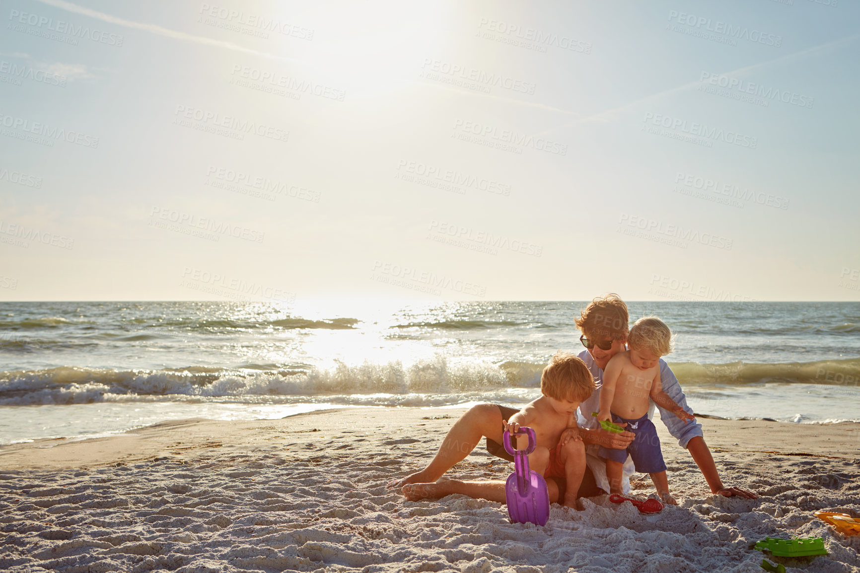 Buy stock photo Playing, relax or children with father at beach on holiday vacation or happy family weekend together. Single parent, fun dad or kids siblings at sea for bonding, love or wellness in nature in Spain