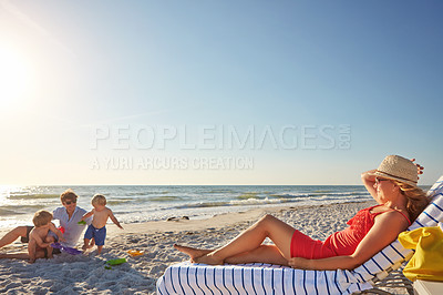 Buy stock photo Family, beach and woman relax on chair in sunlight, blue sky adventure and bonding in summer holiday. Peace, mother and sunglasses resting by ocean, travel and freedom for tropical vacation in Greece