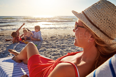 Buy stock photo Beach, family and woman relax on chair in sunlight, blue sky adventure or bonding in summer holiday. Peace, mother and sunglasses rest by ocean, travel and freedom for tropical vacation in Greece