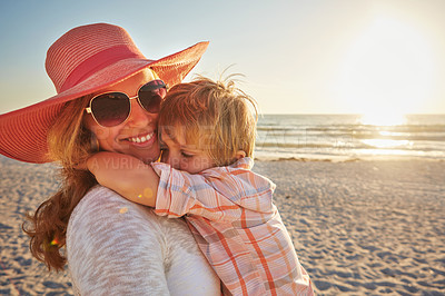 Buy stock photo Happy mother, child and beach with hug in sunset for outdoor holiday, weekend or bonding in nature. Mom, kid and little boy with smile for embrace, love or care in sunshine by ocean coast or sea