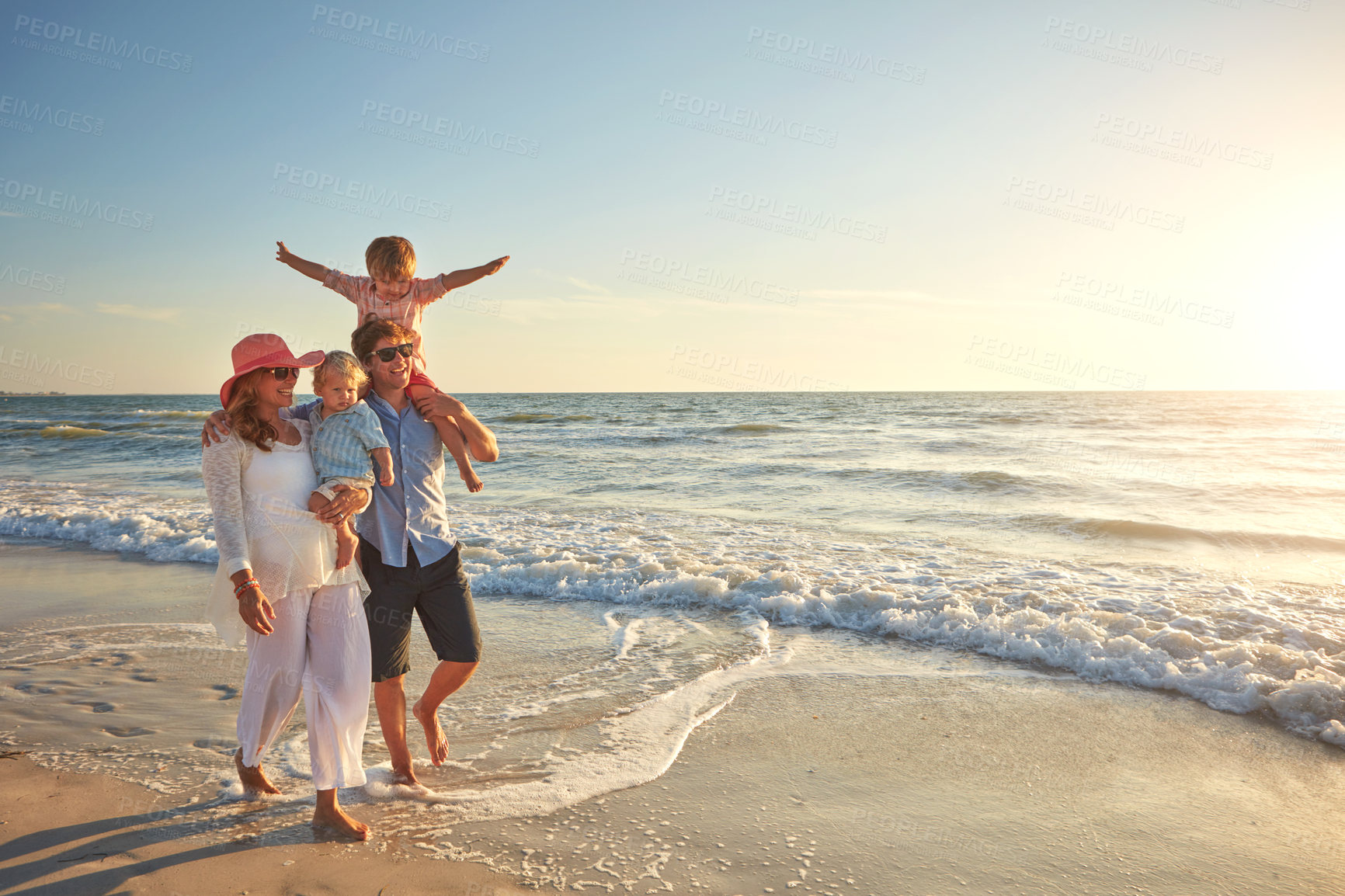 Buy stock photo Happy family, beach holiday and walking, smile for vacation on tropical island. Man, woman and children together with sunglasses by ocean for travel with wellness, mockup space at sunset in Mauritius