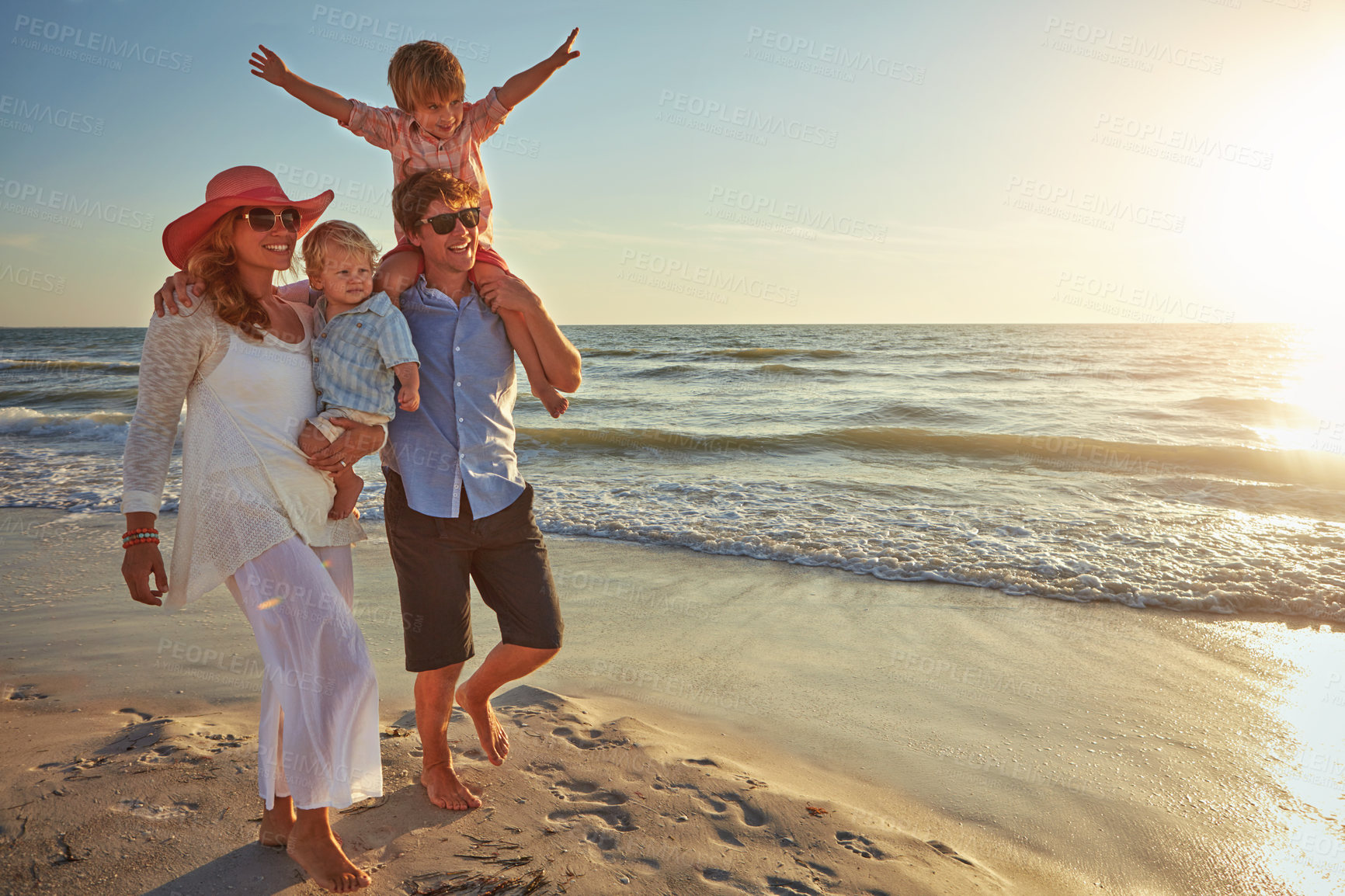 Buy stock photo Family, parents and children on beach trip for holiday fun, vacation and adventure with love. Couple, man and woman and kids on seashore walking with sunset for summer break, support and community