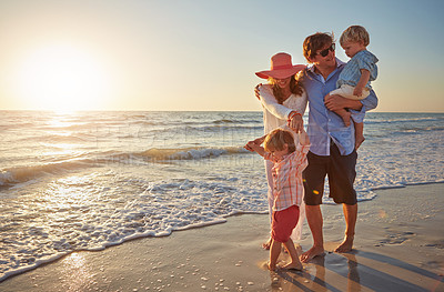 Buy stock photo Family, parents and children on beach trip for holiday fun, vacation and adventure with love. Couple, man and woman and kids on seashore walking with sunset for summer break, support and community