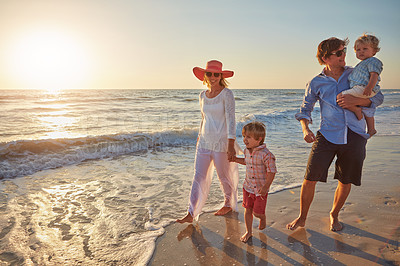 Buy stock photo Family, parents and children on beach trip for holiday fun, vacation and adventure with love. Couple, man and woman and kids on seashore walking with sunset for summer break, support and travel