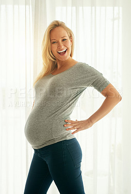 Buy stock photo Shot of a beautiful woman posing with her baby bump