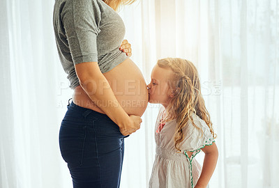 Buy stock photo Cropped shot of a little girl kiss her mother's pregnant belly