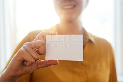 Buy stock photo Cropped shot of an unidentifiable businesswoman holding up a blank card in the office