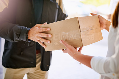 Buy stock photo Customer, box and hands of delivery man giving courier company package at home. Logistics worker at front door of woman or client with a cardboard parcel for e commerce shipping or mail distribution
