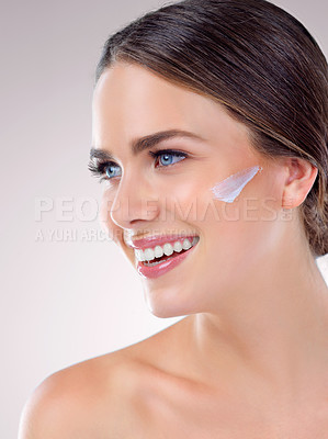 Buy stock photo Woman, cream and studio for moisturizing skincare, beauty and cosmetics lotion for even skin tone. Female person, dermatology and hydration glow on gray background, sunscreen and thinking on benefits