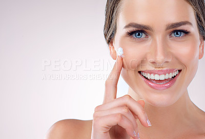 Buy stock photo Face cream, portrait or happy woman with skincare space in studio on white background for mockup, glow or shine. Facial lotion, apply or proud model with smile, beauty lotion or cosmetics results