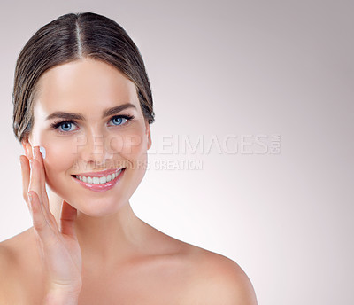 Buy stock photo Studio shot of a beautiful young woman posing against a grey background