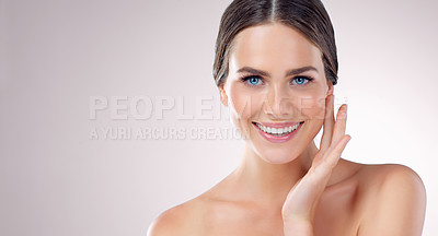 Buy stock photo Studio, skincare and face of woman, beauty and results of treatment, hand and confidence of aesthetic. Pink background, portrait and smile for dermatology, shine or glow for person, soft and wellness