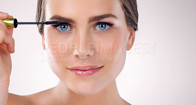 Buy stock photo Makeup, portrait and woman in studio with mascara for self care, beauty and face treatment. Cosmetic, eyelash extensions and female person for Scotland with facial cosmetology by white background.