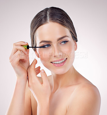 Buy stock photo Makeup, glow and woman in studio with mascara for self care, beauty and face treatment. Cosmetic, eyelash extensions and female person for Scotland with facial cosmetology by white background.