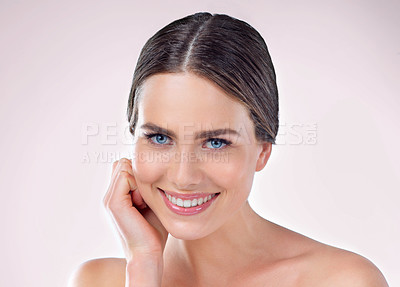 Buy stock photo Studio, skincare and face of woman, proud and results of treatment, hand and confidence of aesthetic. Pink background, portrait and smile for dermatology, shine and glow for person, soft and wellness