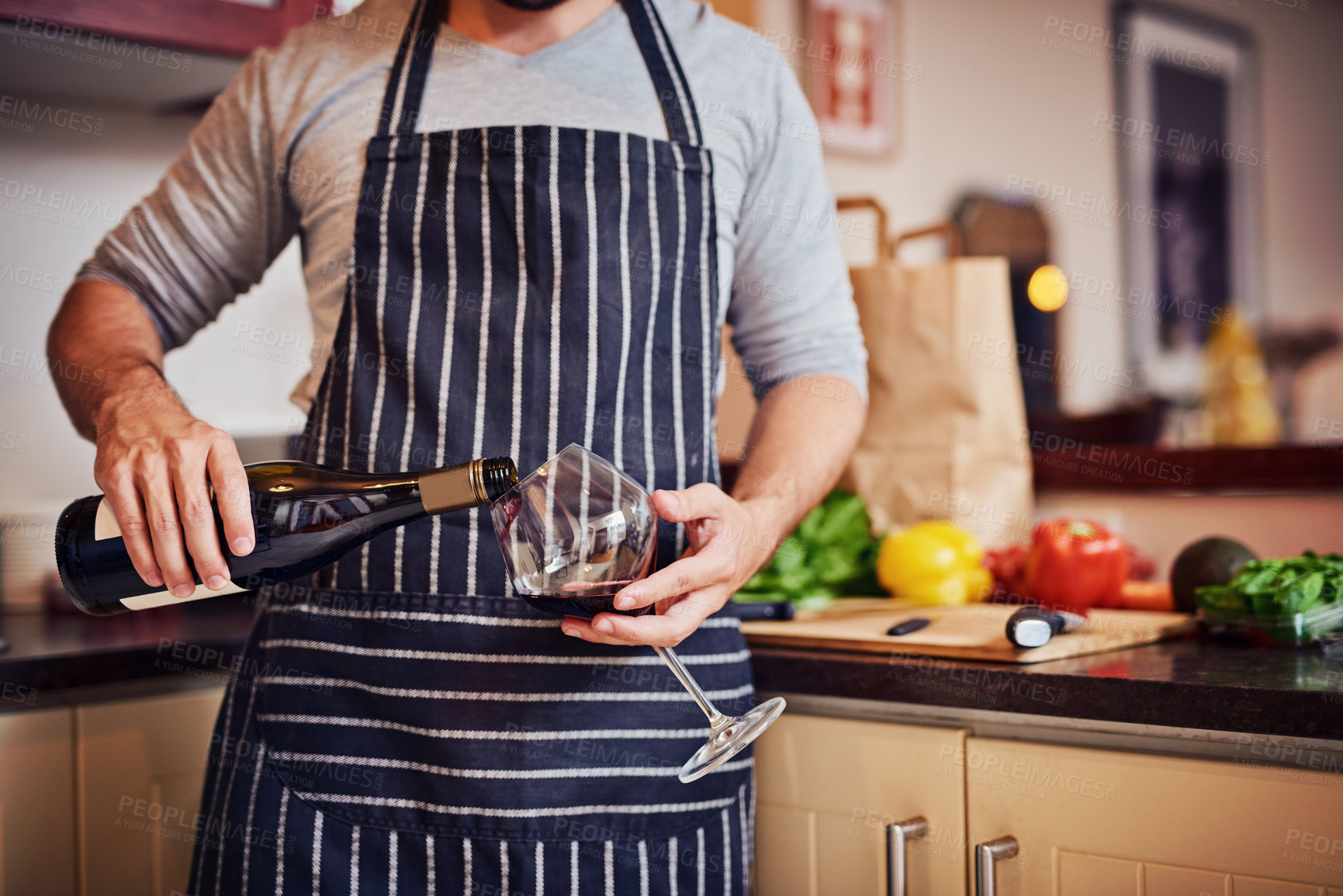 Buy stock photo Hands, red wine and person with vegetables for health, nutrition or vegan diet for wellness. Alcohol, culinary hobby and drink in kitchen for cooking with food and relaxing to prepare dinner or lunch