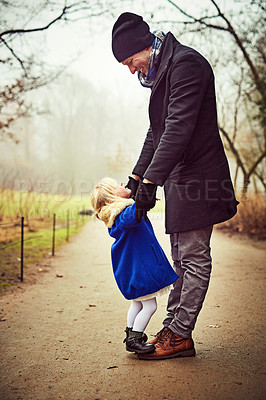 Buy stock photo Shot of an adorable little girl with her father outdoors