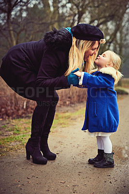 Buy stock photo Shot of an adorable little girl and her mother outdoors