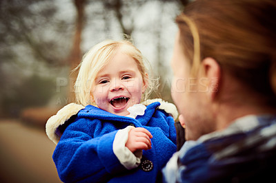 Buy stock photo Shot of an adorable little girl with her unrecognizable father outdoors