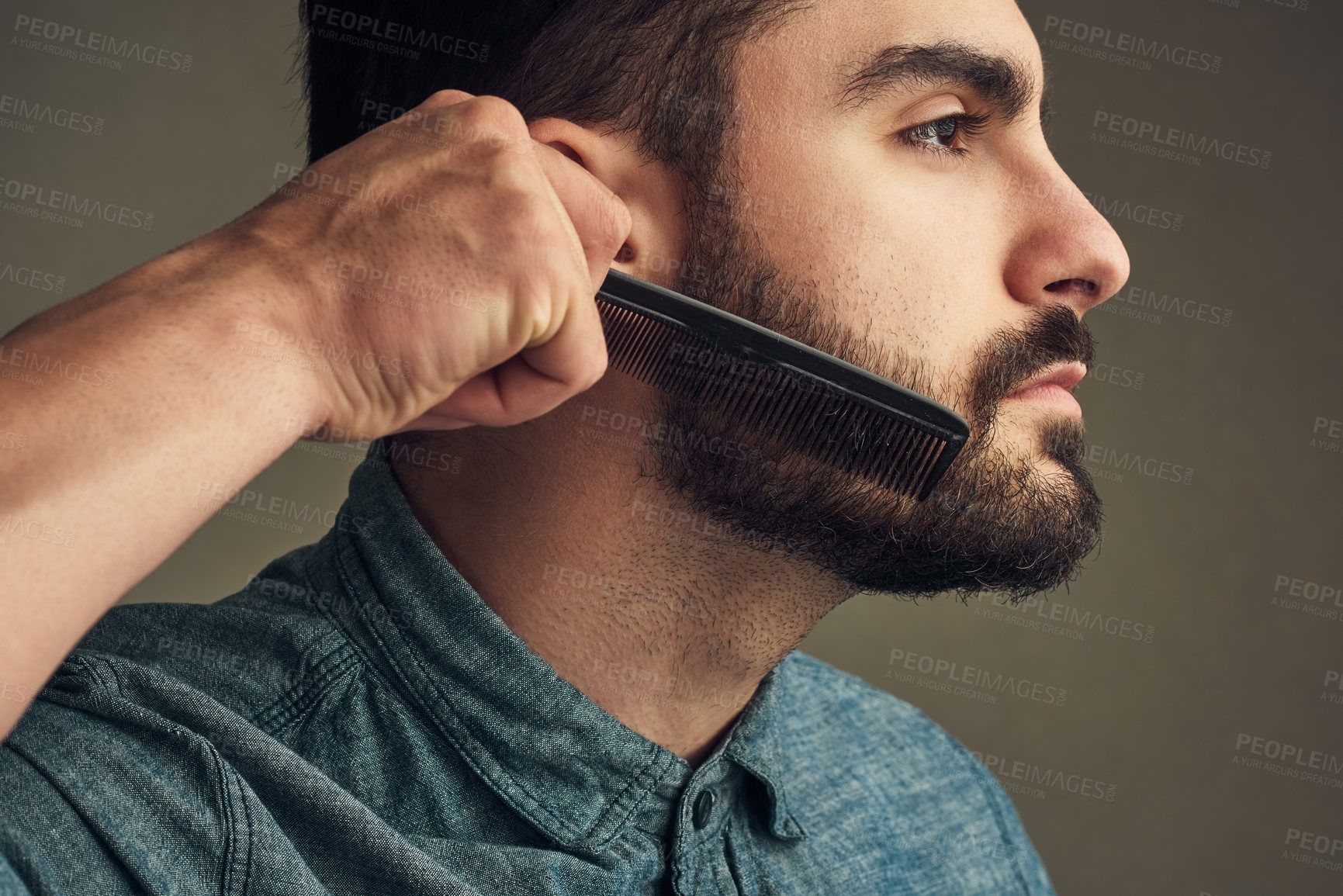 Buy stock photo Man, beauty and comb beard on studio background for facial hair maintenance, self care and texture. Male person, cleaning and personal hygiene on face for skin, grooming and morning routine as barber