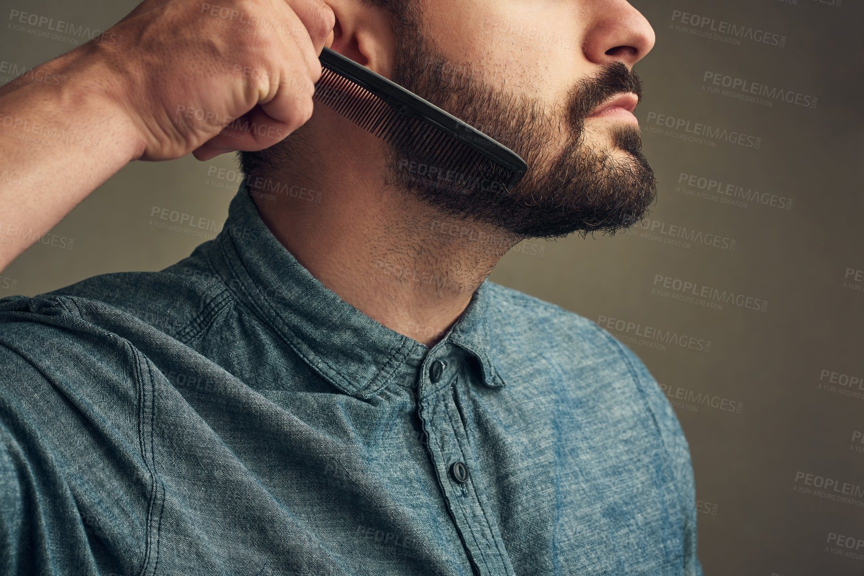 Buy stock photo Man, cleaning and comb beard on studio background for facial hair maintenance, self care and texture. Male person, grooming and personal hygiene on face for skin, beauty and morning routine as barber