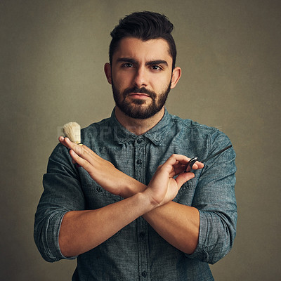 Buy stock photo Man, shaving brush and barber portrait on studio background, confident and ready for hair removal. Male person, grooming kit and serious for cosmetics or epilation, maintenance and hygiene routine