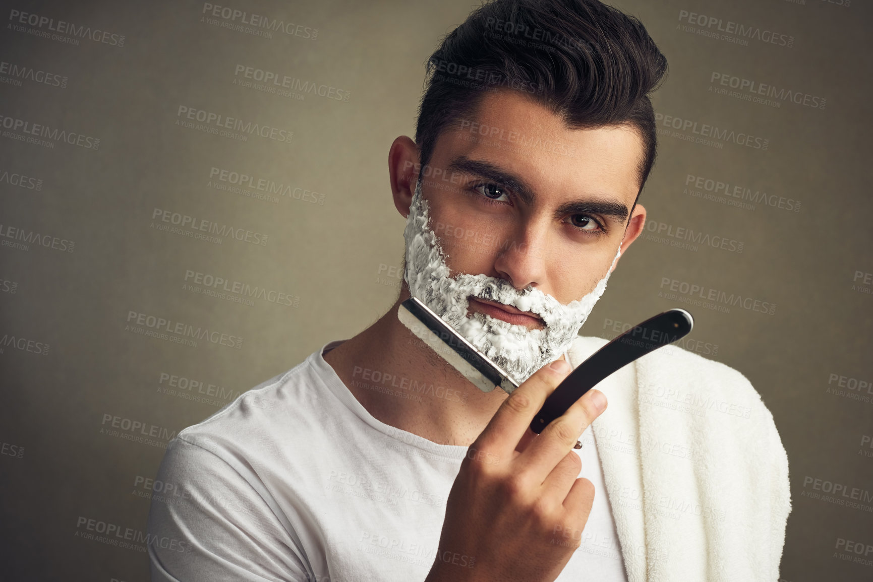 Buy stock photo Man, razor and shaving beard on studio background for facial hair maintenance, self care and texture. Male person, cleaning and personal hygiene with portrait, foam and morning routine as barber