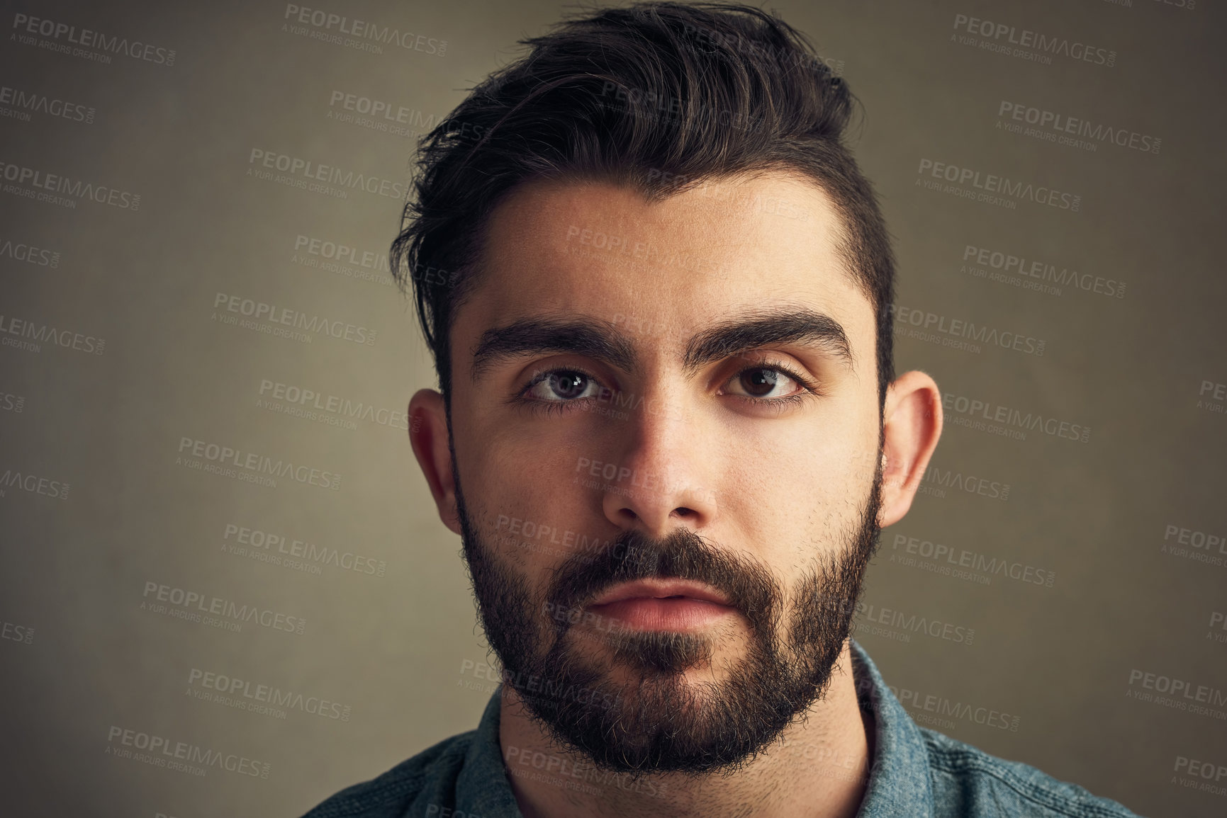 Buy stock photo Closeup of a handsome young man posing against a grey background