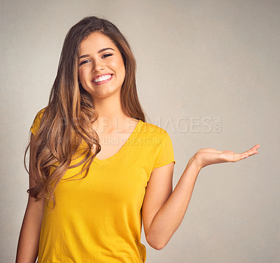 Buy stock photo Shot of an attractive young woman supporting copy space with her hand