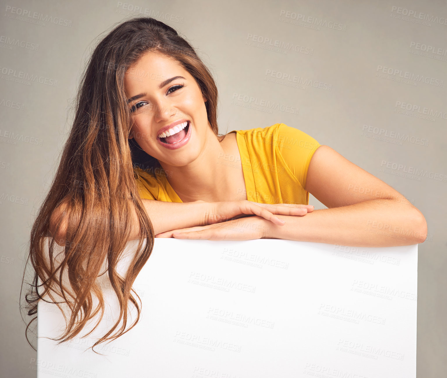 Buy stock photo Poster, laugh and portrait of woman in studio for news, announcement and information. Mockup space, advertising and person with sign, bulletin or banner for sale, deal and bargain on grey background