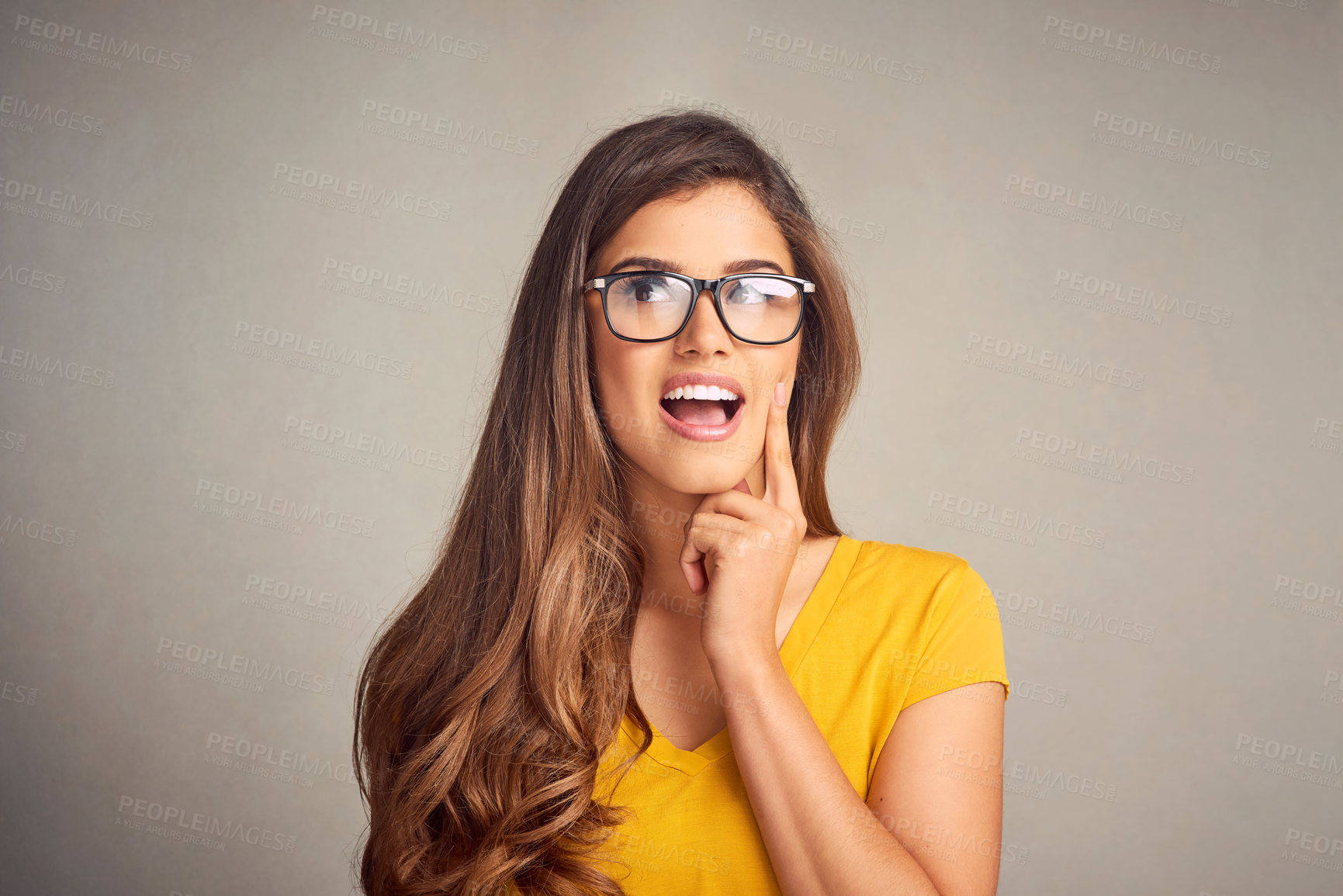 Buy stock photo Woman, glasses and thinking in studio for idea, problem solving and brainstorming with choice. Female person, editor and planning on grey background for decision, vision and creative inspiration