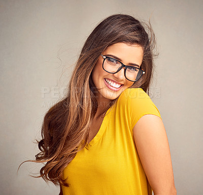 Buy stock photo Studio, fashion and portrait of woman with glasses, confidence and positive attitude with smile. Happy, face and girl in gen z style with pride, vision and eye care wellness on grey background in USA