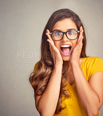 Buy stock photo Woman, portrait and surprise in studio for news, announcement and secret information with glasses. Female person, face and shock on gray background for sale, deal and wow with omg, wtf or coming soon