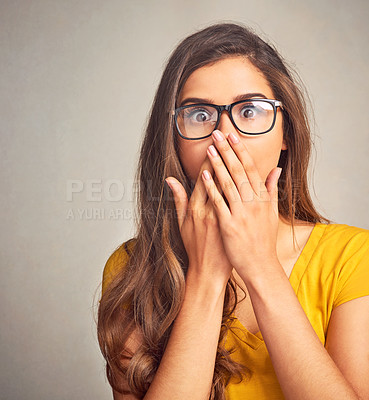 Buy stock photo Closeup of an expressive young woman against a grey background