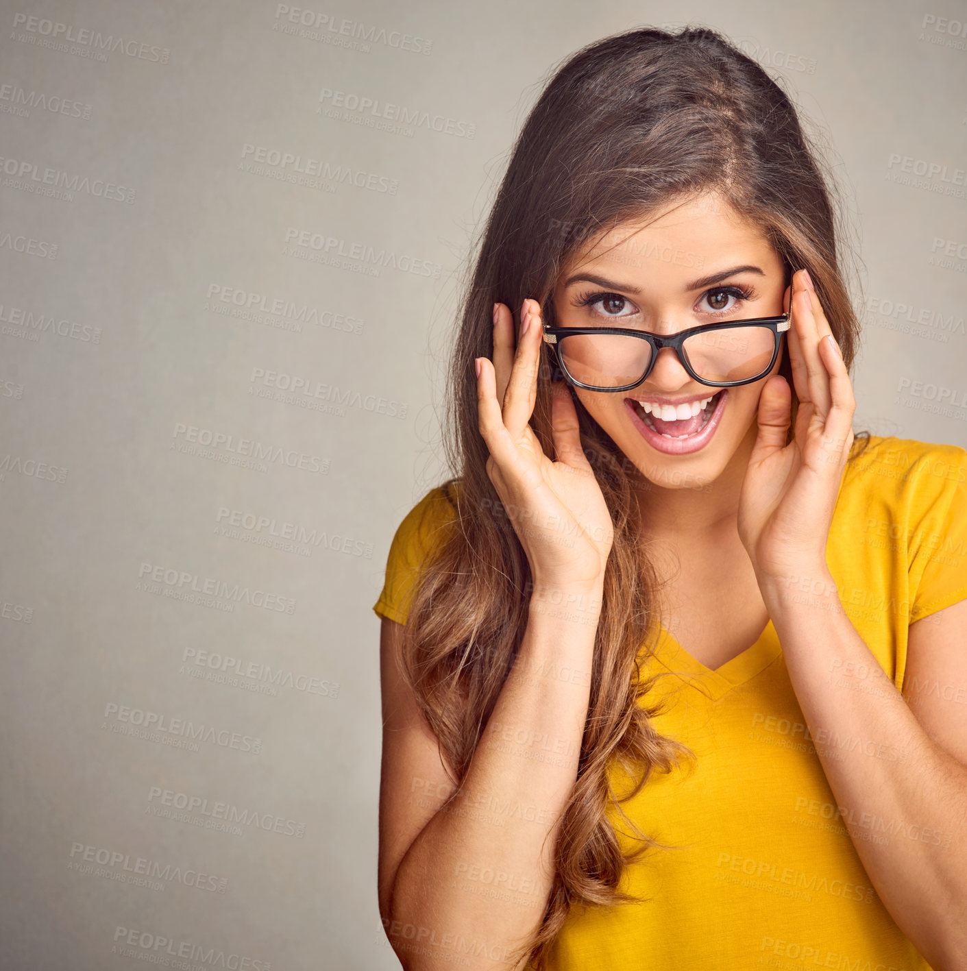 Buy stock photo Studio, fun and portrait of woman with glasses, confidence  and positive attitude in trendy fashion. Happy, face and girl in gen z style with pride, vision and eye care wellness on grey background