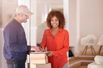 Buy stock photo Shot of a young woman receiving a package and signing  it while looking at the camera in her home