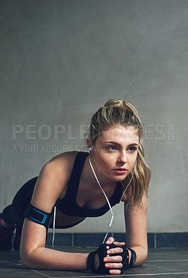 Buy stock photo Fitness, headphones and woman plank in gym with music for wellness, health and strength. Sports, core muscle and person listening to radio, podcast and song for exercise, training and workout