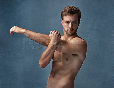 Buy stock photo Fitness, man and stretching arm in studio for healthy body, wellness and exercise preparation. Flexibility, warm up and shirtless model ready to start workout for tricep muscle or abs on background